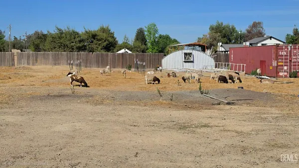 a swimming pool with wooden fence