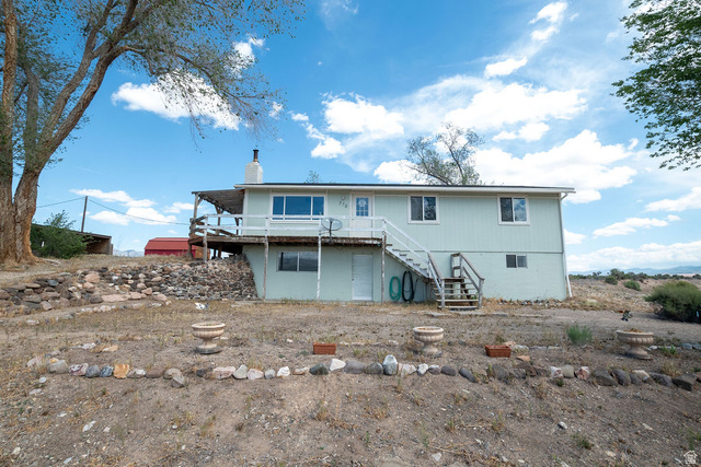 570 West Main Street Beaver, UT 84713 - Photo 1 of 43 Split-level exterior featuring light green siding and white trim