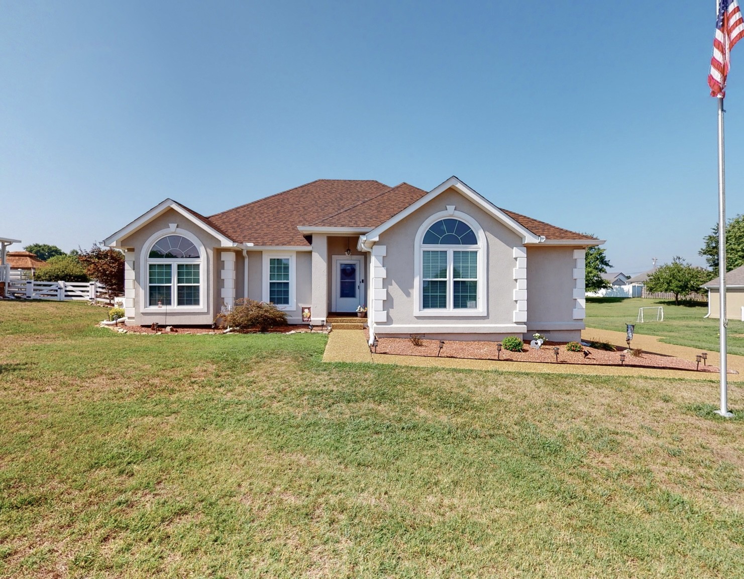 1208 Hunters Point Lane Spring Hill, TN 37174 - Photo 1 of 31 a front view of a house with a garden and yard