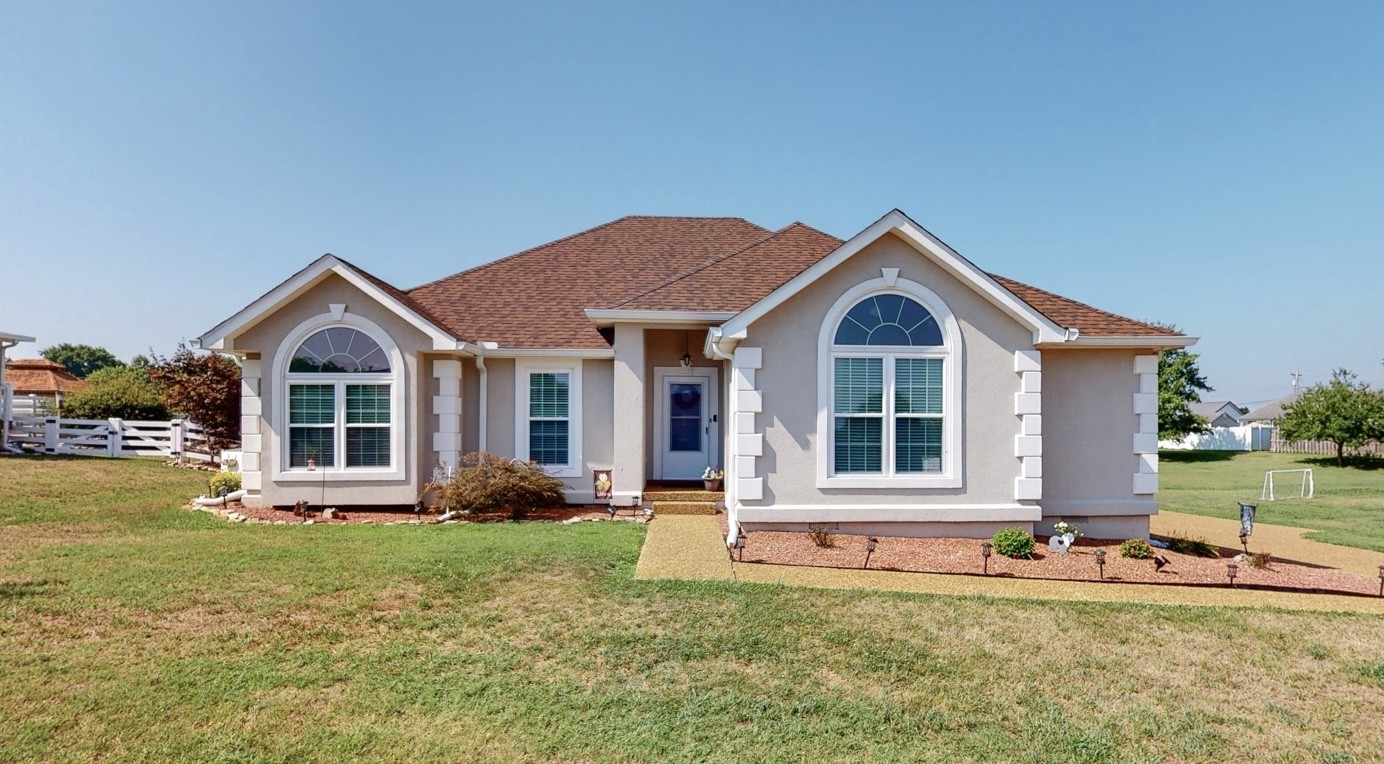 1208 Hunters Point Lane Spring Hill, TN 37174 - Photo 2 of 31 a front view of a house with a yard and porch