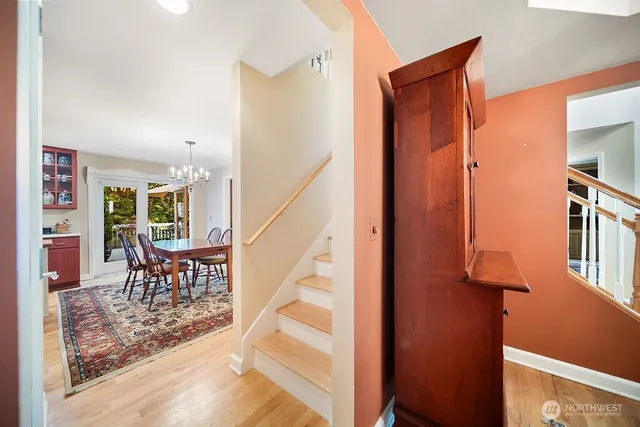 a reading room with furniture and a wooden floor