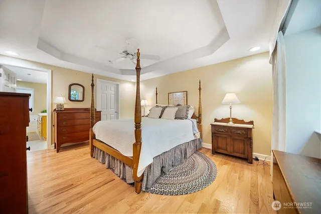 a bed room with a bed and a chair