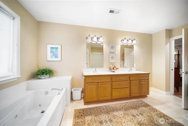 a bathroom with a bathtub and shower
