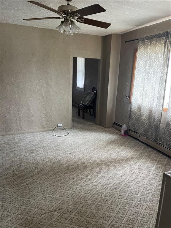 97 A & B United Rd Mount Mount Pleasant, PA 15666 - Photo 5 of 17 a view of a livingroom with a fireplace