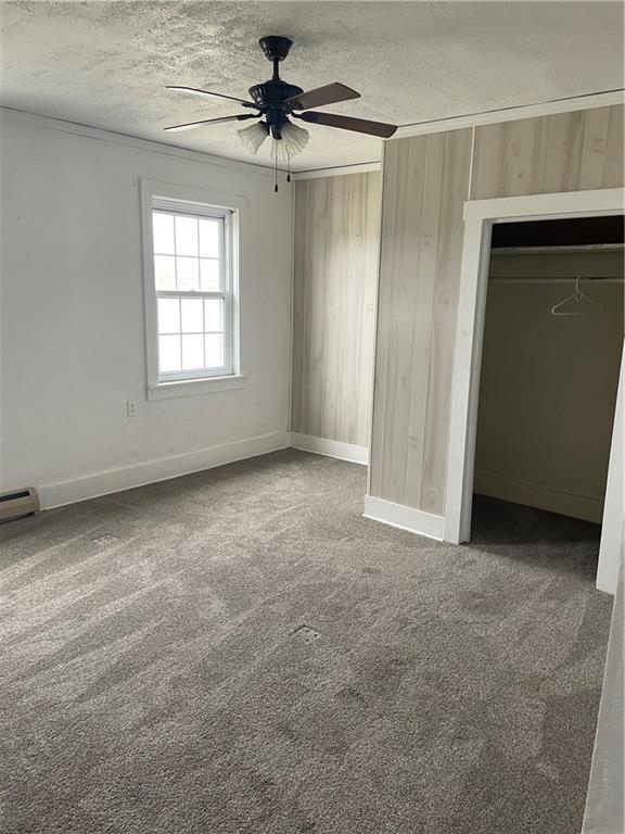 97 A & B United Rd Mount Mount Pleasant, PA 15666 - Photo 8 of 17 an empty room with windows and fan