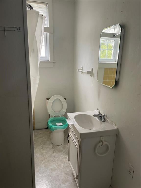 97 A & B United Rd Mount Mount Pleasant, PA 15666 - Photo 9 of 17 a bathroom with a sink and toilet