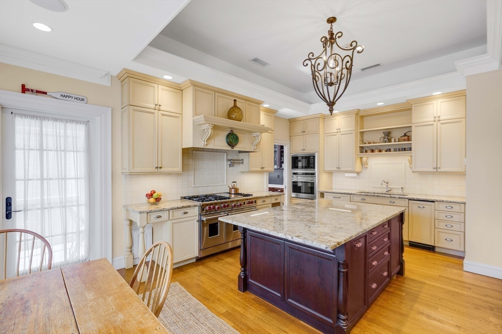 26 Winter Street Salem, MA 01970 - Photo 11 of 42 a kitchen with stainless steel appliances granite countertop a stove a sink dishwasher and a refrigerator