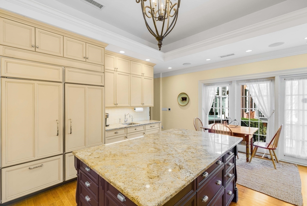 26 Winter Street Salem, MA 01970 - Photo 13 of 42 a kitchen with stainless steel appliances granite countertop table chairs and cabinets