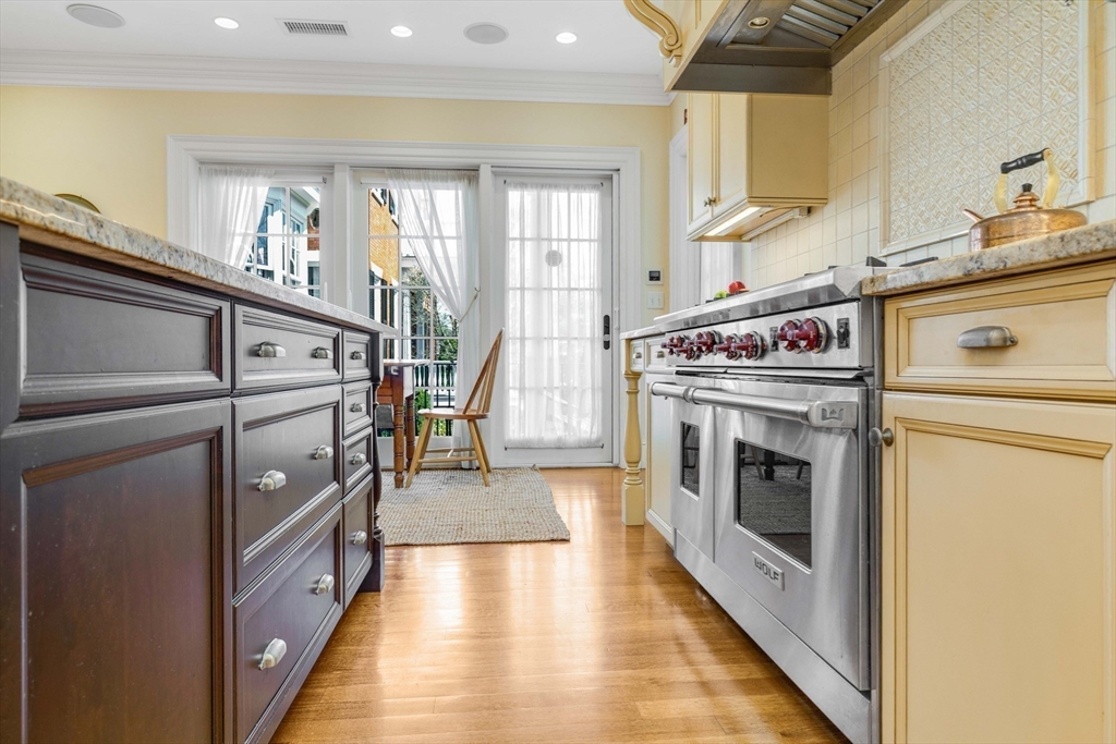 26 Winter Street Salem, MA 01970 - Photo 15 of 42 a kitchen with a stove top oven and a sink