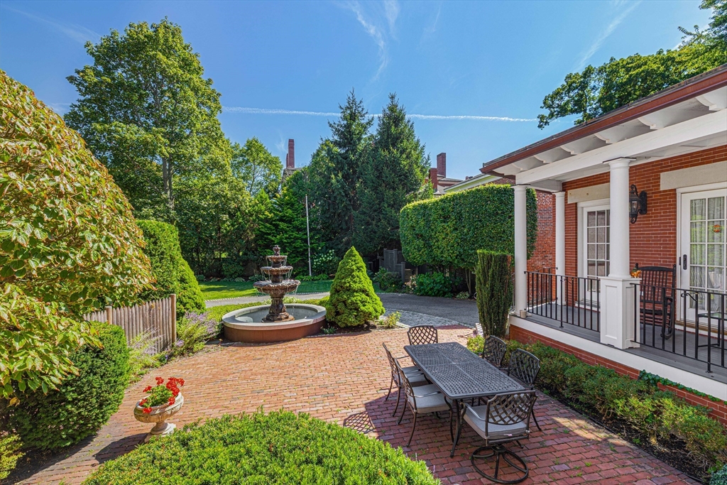 26 Winter Street Salem, MA 01970 - Photo 17 of 42 a view of a chair and table in backyard of the house