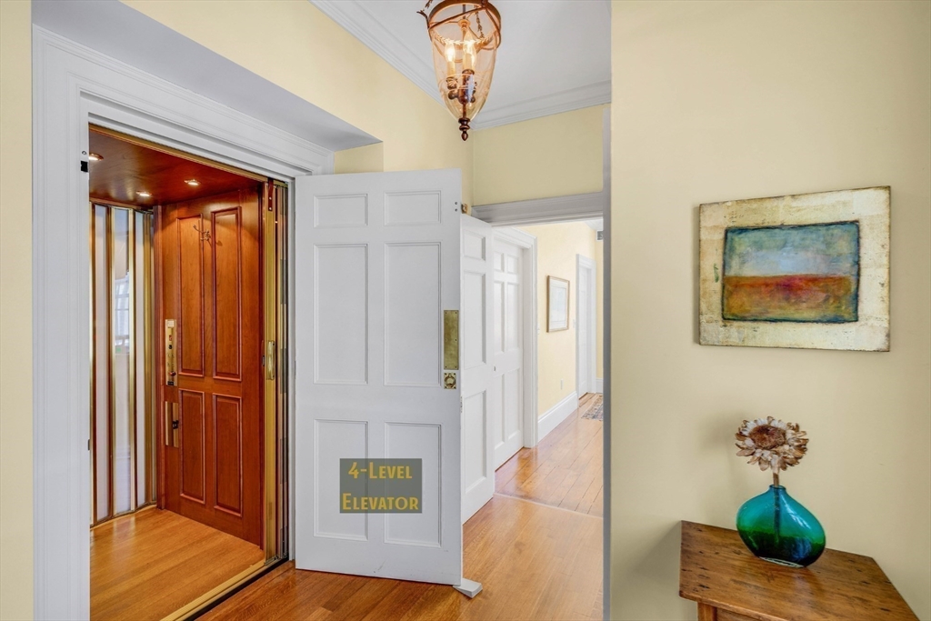 26 Winter Street Salem, MA 01970 - Photo 18 of 42 a living room with furniture and a chandelier