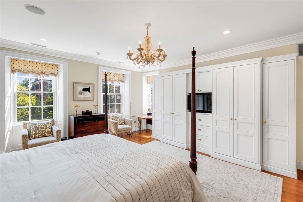 26 Winter Street Salem, MA 01970 - Photo 20 of 42 a bedroom with bed a flat tv screen and large windows