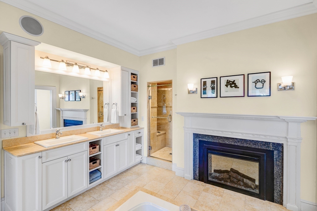 26 Winter Street Salem, MA 01970 - Photo 24 of 42 a spacious bedroom with a fireplace and a sink