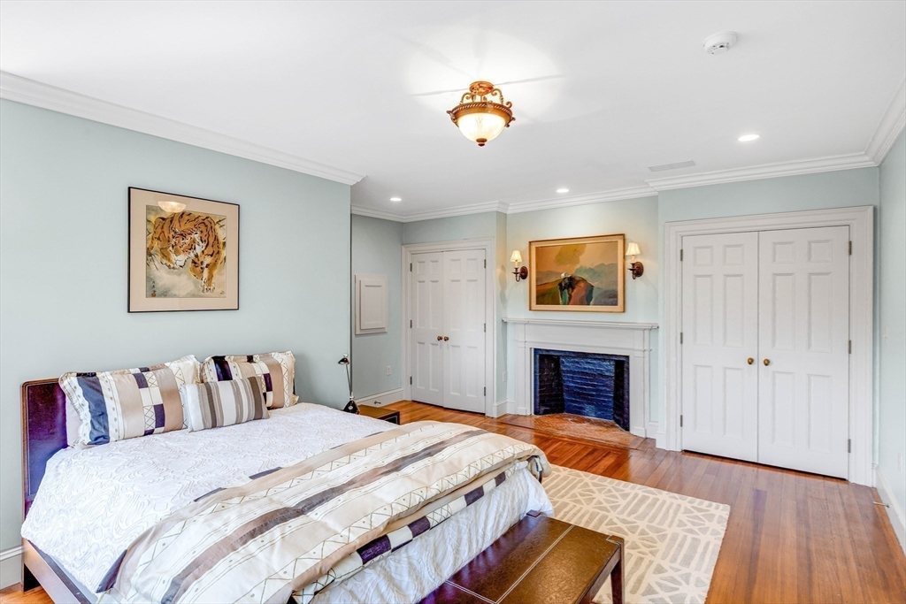 26 Winter Street Salem, MA 01970 - Photo 29 of 42 a bedroom with a bed and a fireplace