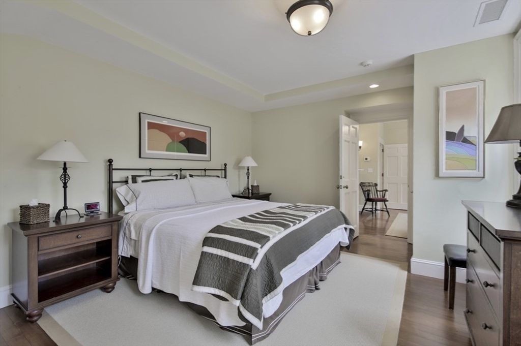 26 Winter Street Salem, MA 01970 - Photo 32 of 42 a bedroom with a bed and a lamp