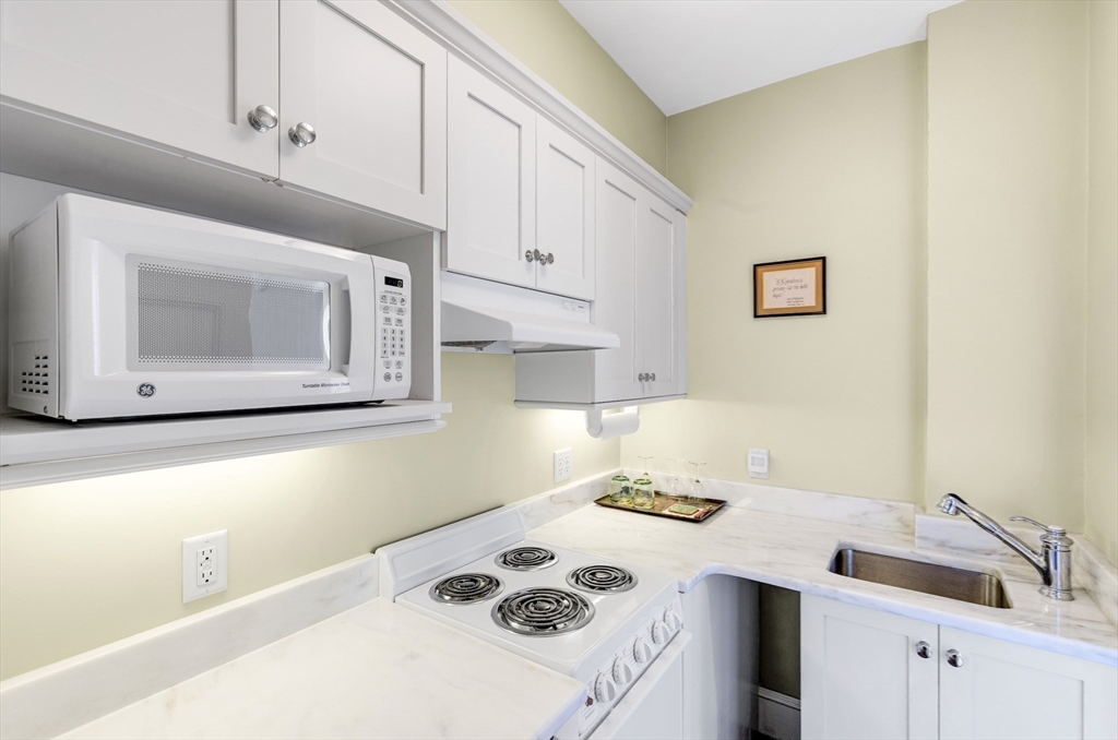 26 Winter Street Salem, MA 01970 - Photo 33 of 42 a kitchen with a sink cabinets and appliances