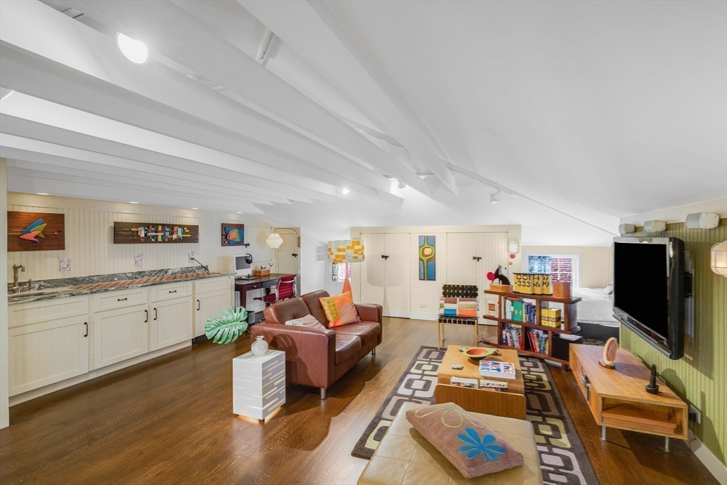 26 Winter Street Salem, MA 01970 - Photo 35 of 42 a living room with furniture and a flat screen tv