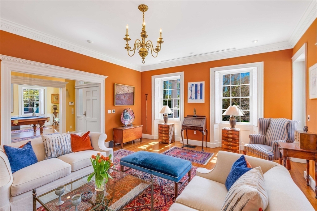 26 Winter Street Salem, MA 01970 - Photo 4 of 42 a living room with furniture and a chandelier