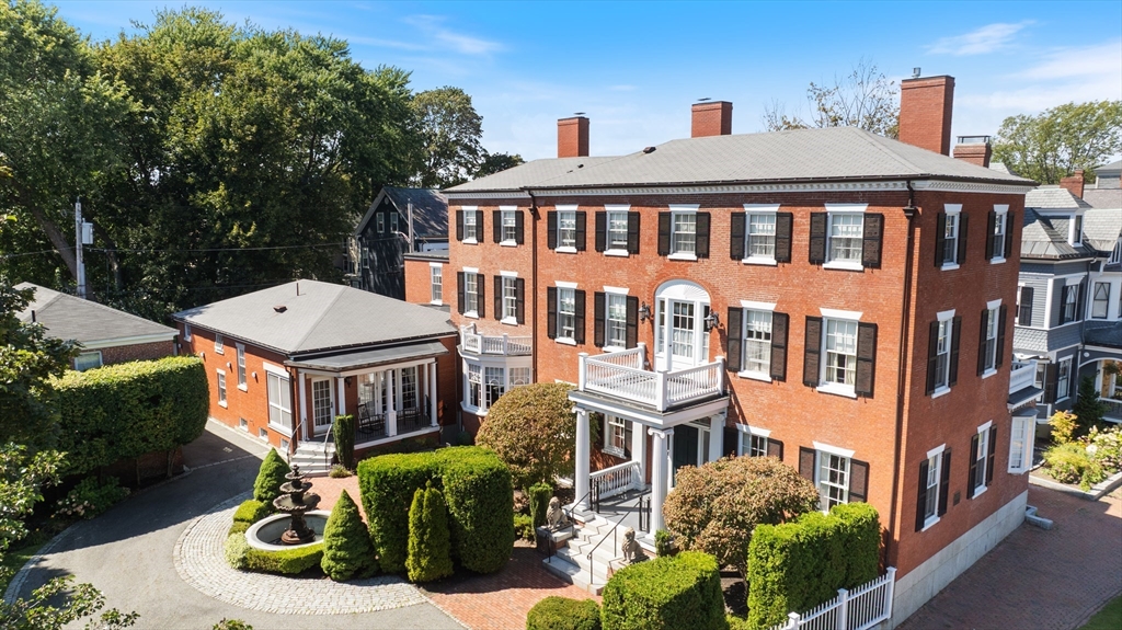 26 Winter Street Salem, MA 01970 - Photo 41 of 42 a front view of a residential apartment building with a yard