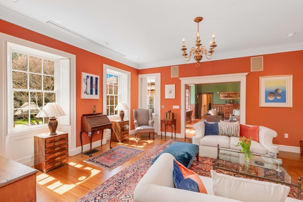 26 Winter Street Salem, MA 01970 - Photo 6 of 42 a living room with furniture a chandelier and a floor to ceiling window