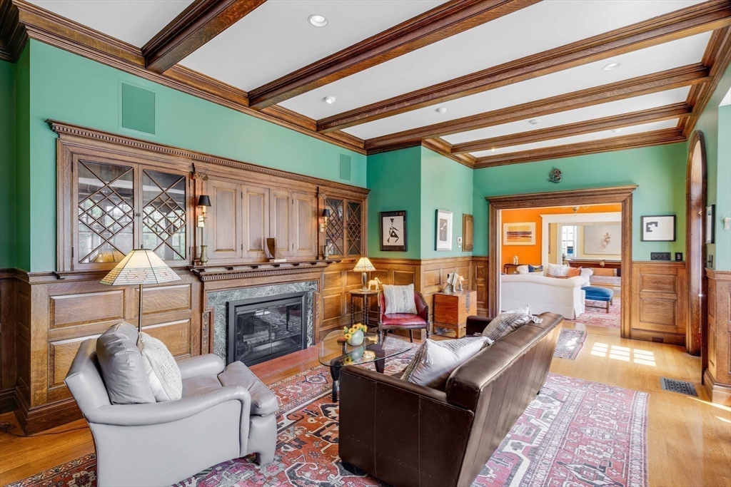 26 Winter Street Salem, MA 01970 - Photo 10 of 42 a living room with fireplace furniture and a wooden floor