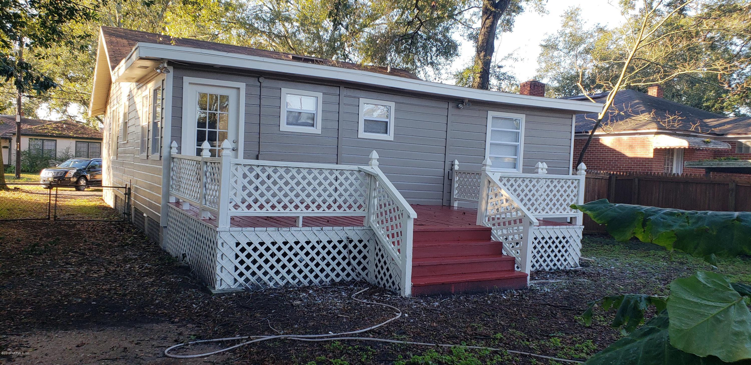4633 Manchester Road Jacksonville, FL 32210 - Photo 2 of 26 a front view of a house with a yard