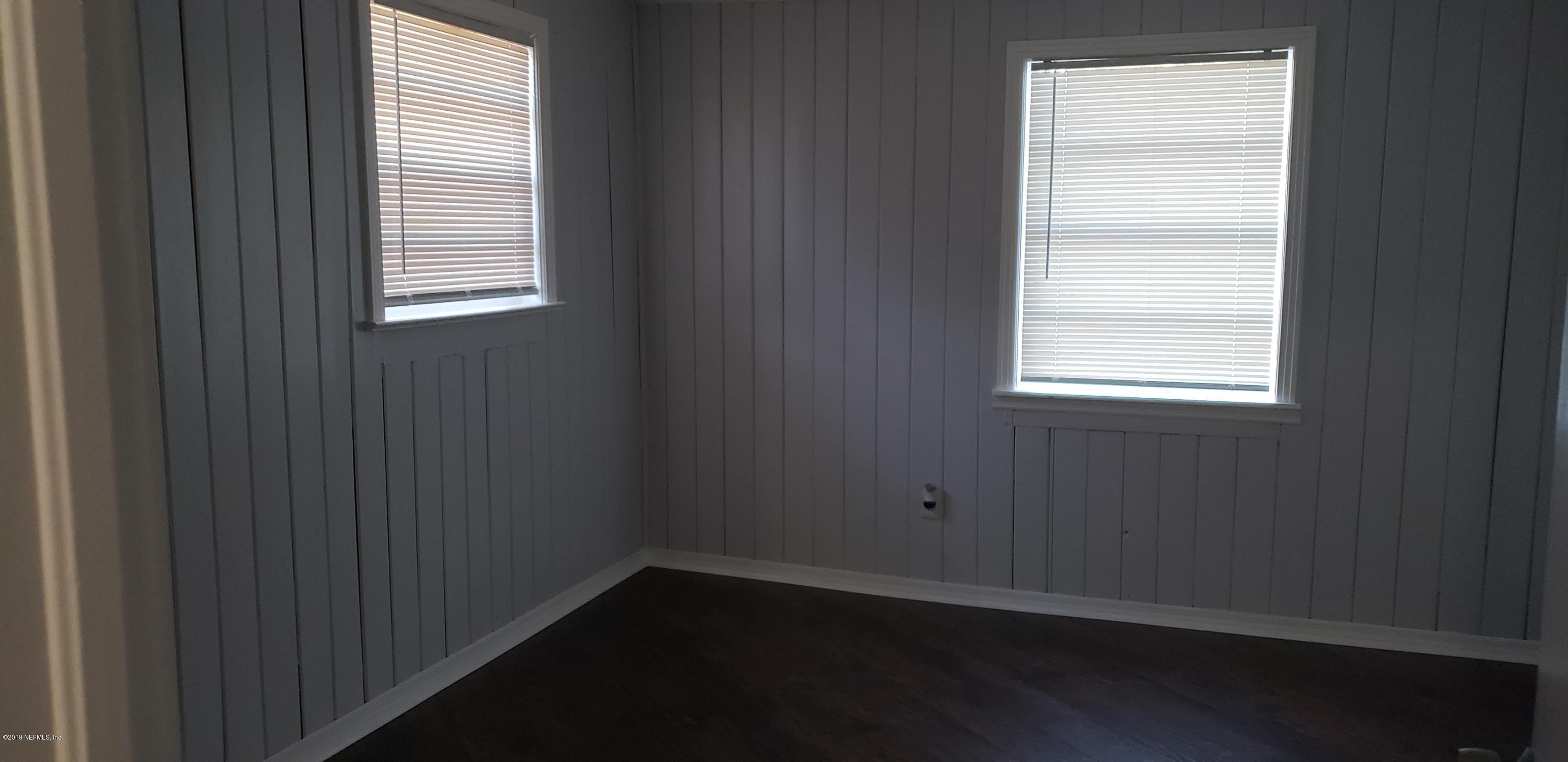 4633 Manchester Road Jacksonville, FL 32210 - Photo 6 of 26 an empty room with a window