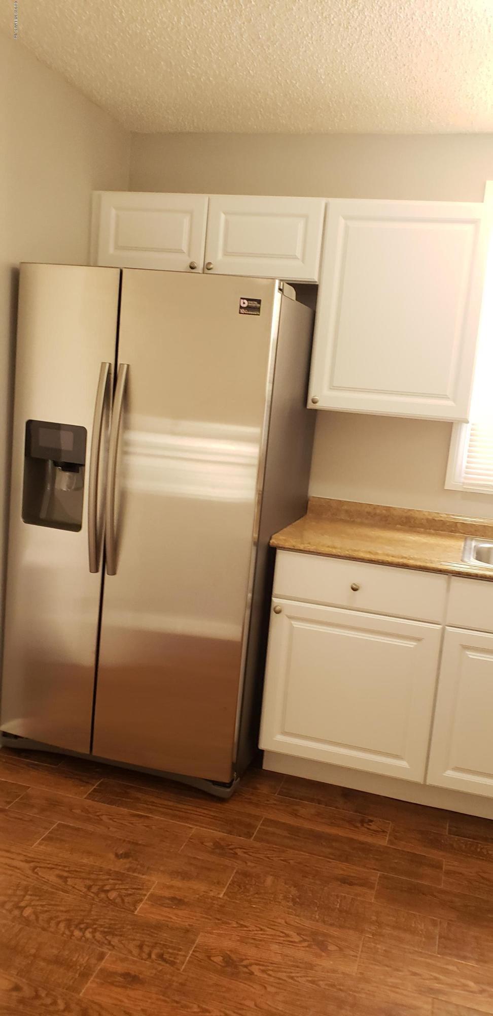 4633 Manchester Road Jacksonville, FL 32210 - Photo 10 of 26 a utility room with dryer and washer
