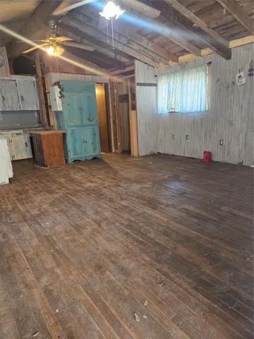 a view of a room with wooden walls