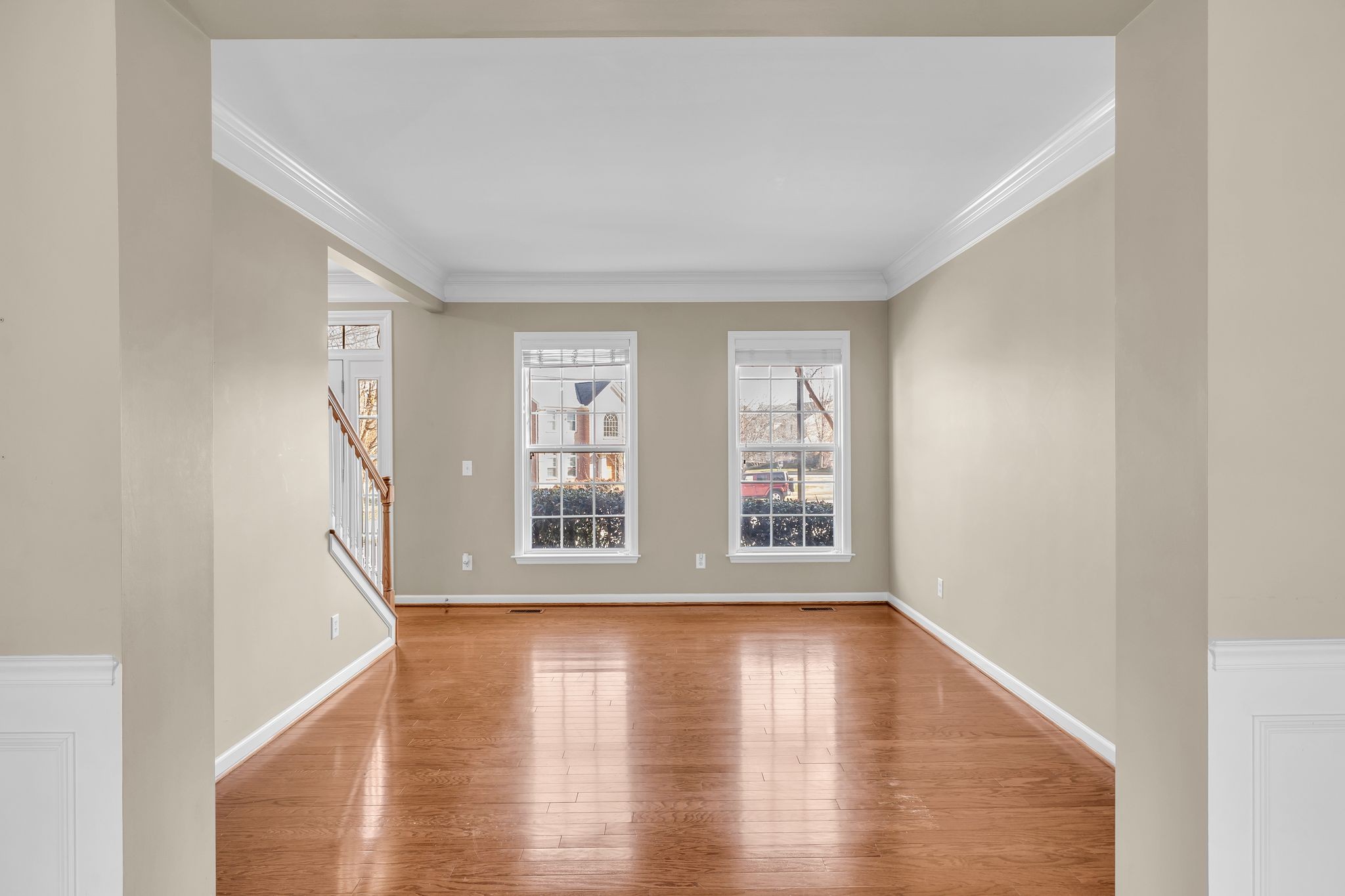 105 Lagan Court Franklin, TN 37064 - Photo 12 of 51 a view of an empty room with wooden floor and a window
