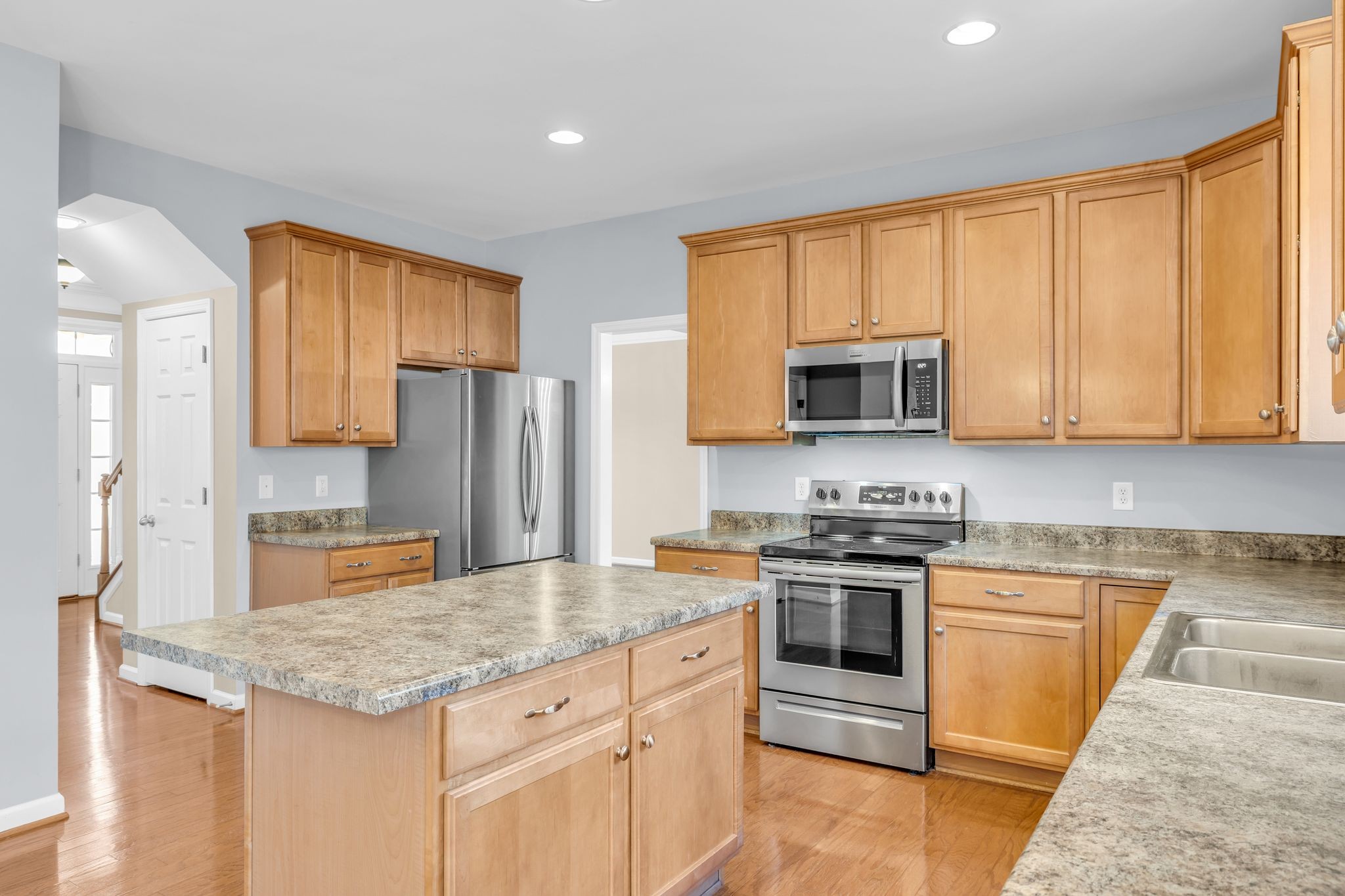 105 Lagan Court Franklin, TN 37064 - Photo 18 of 51 a kitchen with stainless steel appliances granite countertop a stove top oven a sink and dishwasher