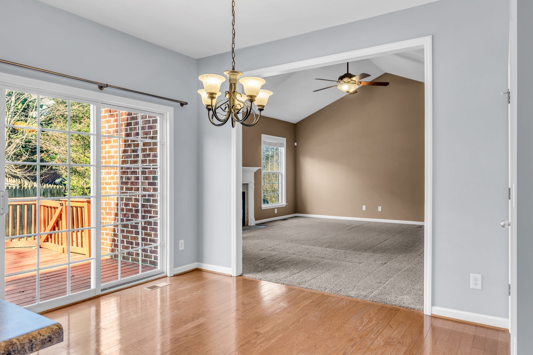 105 Lagan Court Franklin, TN 37064 - Photo 22 of 51 a view of a livingroom with a chandelier wooden floor and windows
