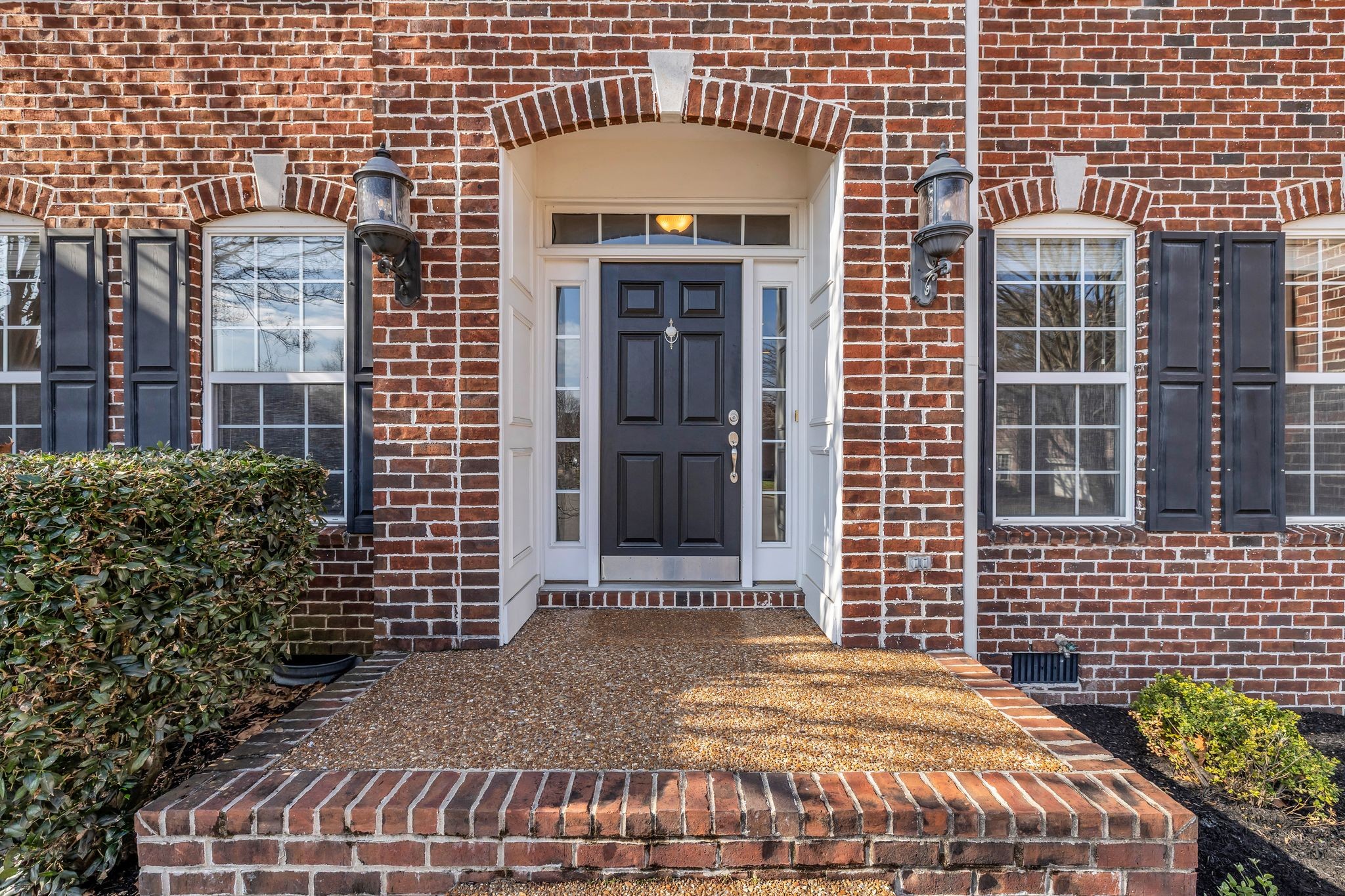 105 Lagan Court Franklin, TN 37064 - Photo 4 of 51 a front view of a building with a garden