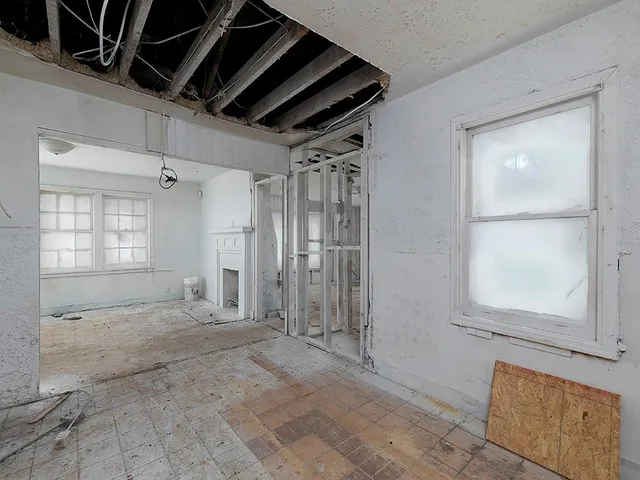 a bathroom with a shower and a sink