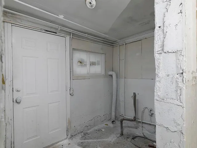 a bathroom with a toilet sink and shower