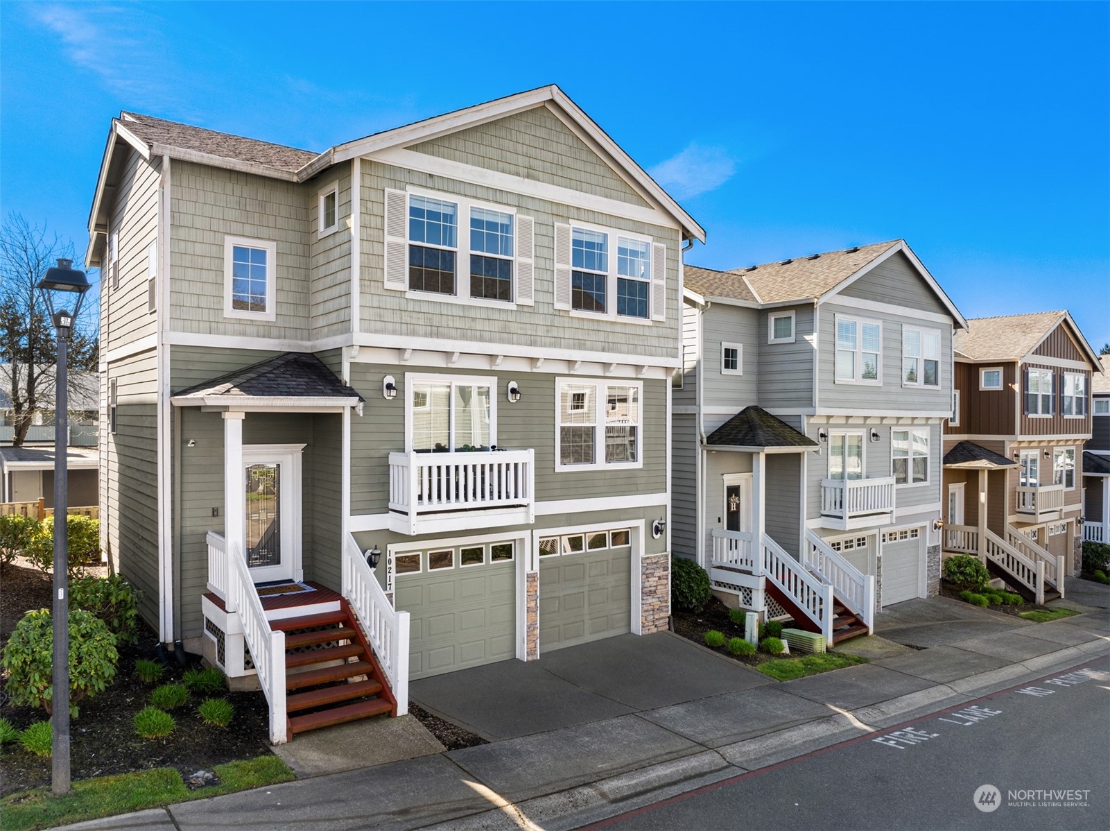 10217 Southeast 237th Street Kent, WA 98031 - Photo 1 of 28 a front view of a house with a yard