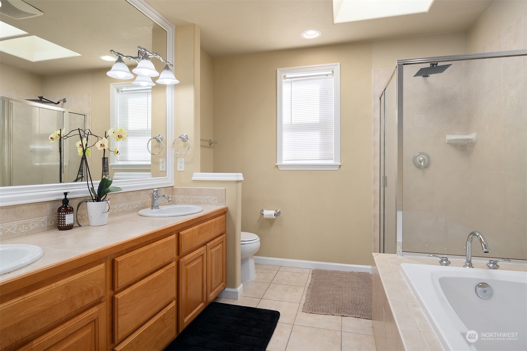 10217 Southeast 237th Street Kent, WA 98031 - Photo 14 of 28 a bathroom with a double vanity sink mirror and double