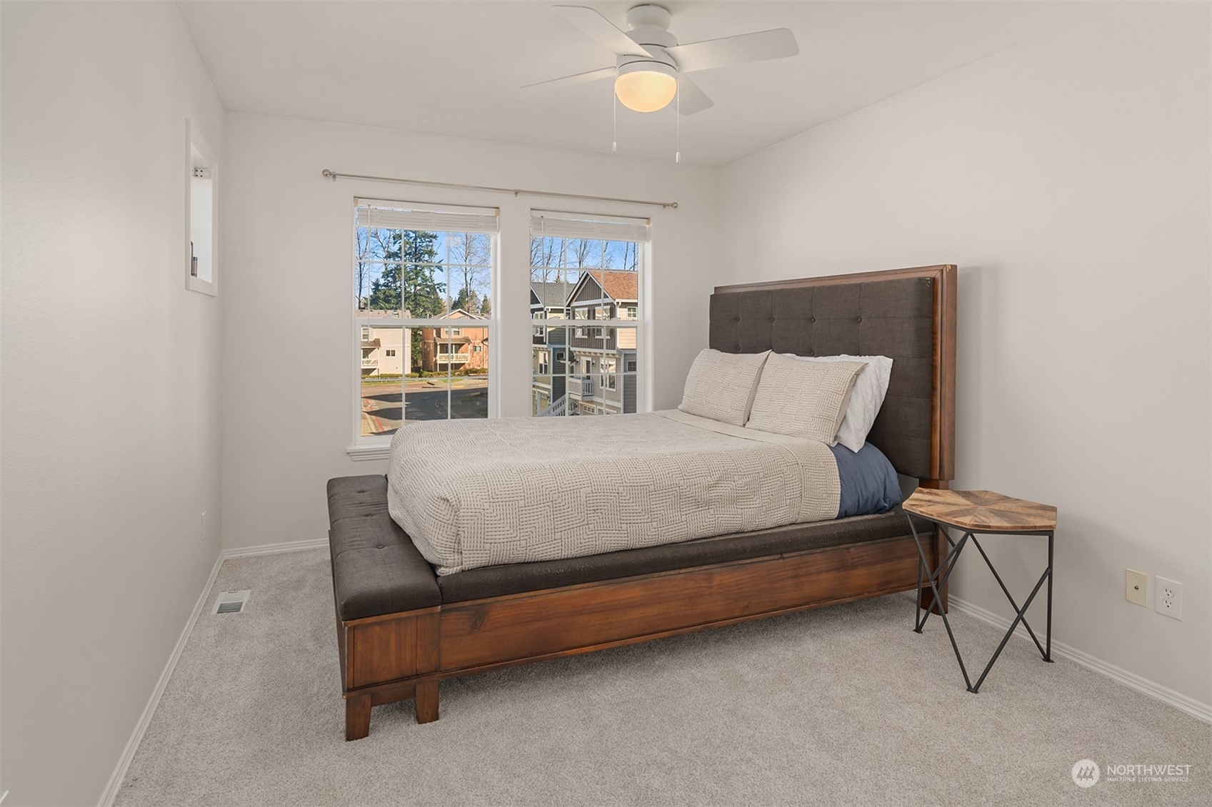 10217 Southeast 237th Street Kent, WA 98031 - Photo 19 of 28 a bedroom with a bed chair and window