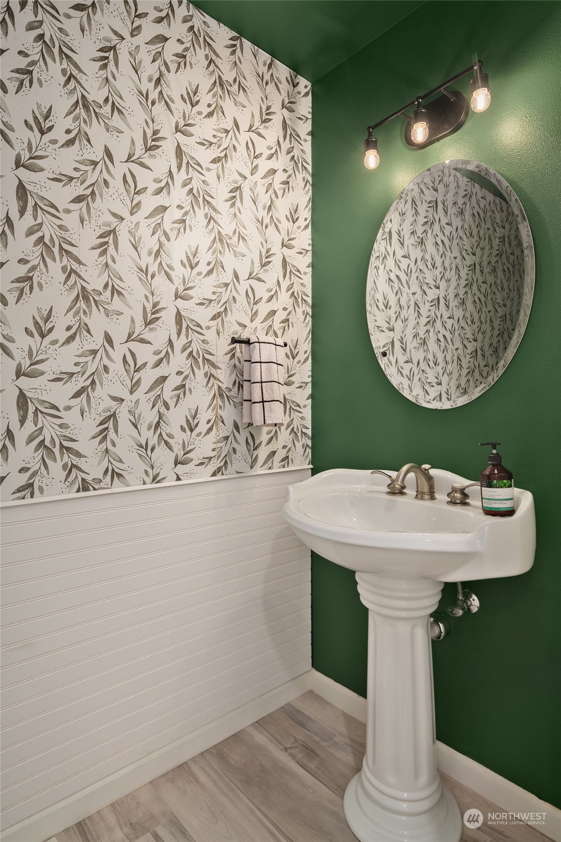10217 Southeast 237th Street Kent, WA 98031 - Photo 20 of 28 a bathroom with a sink and mirror