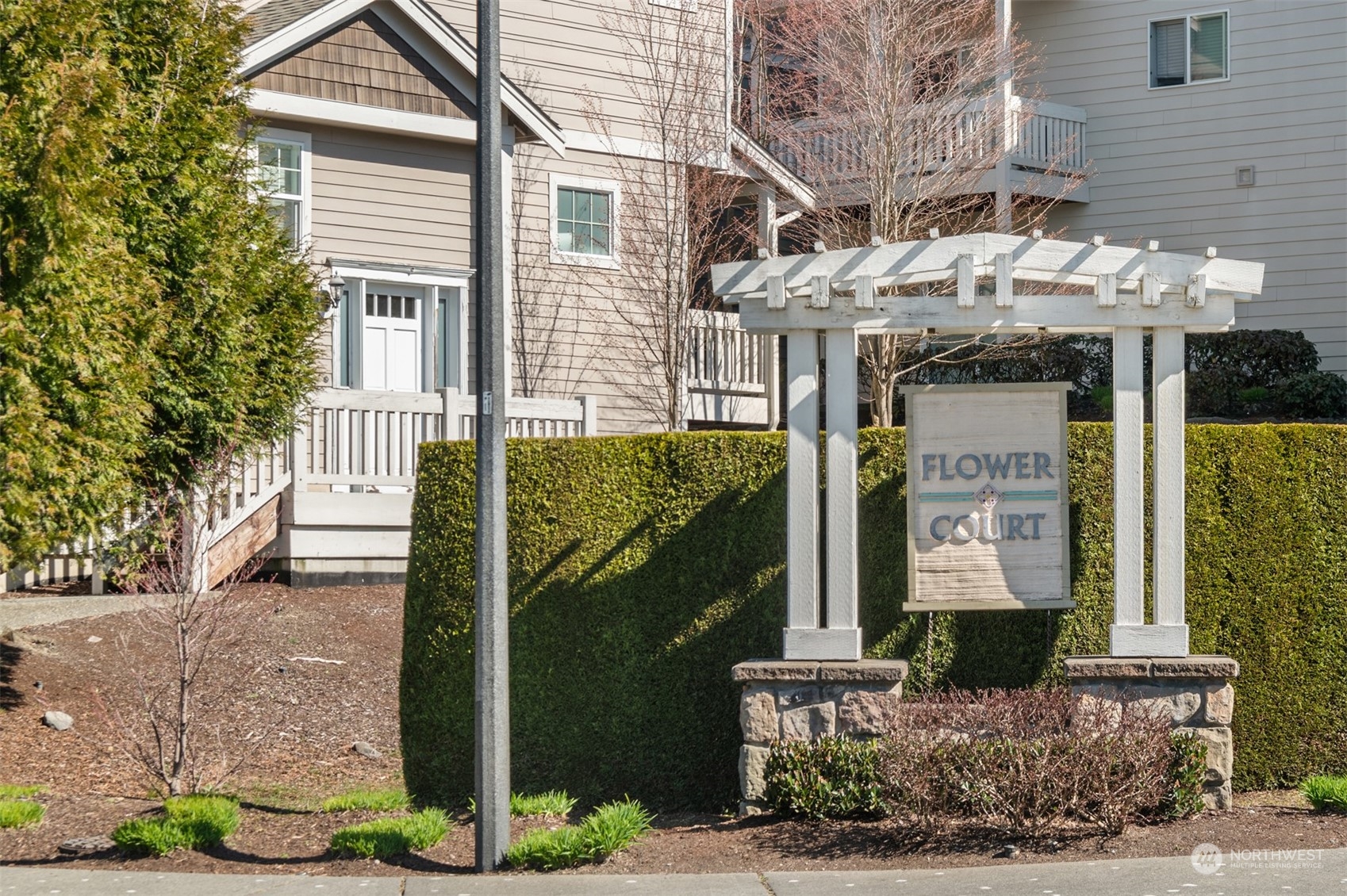 10217 Southeast 237th Street Kent, WA 98031 - Photo 28 of 28 a front view of a house with a garden