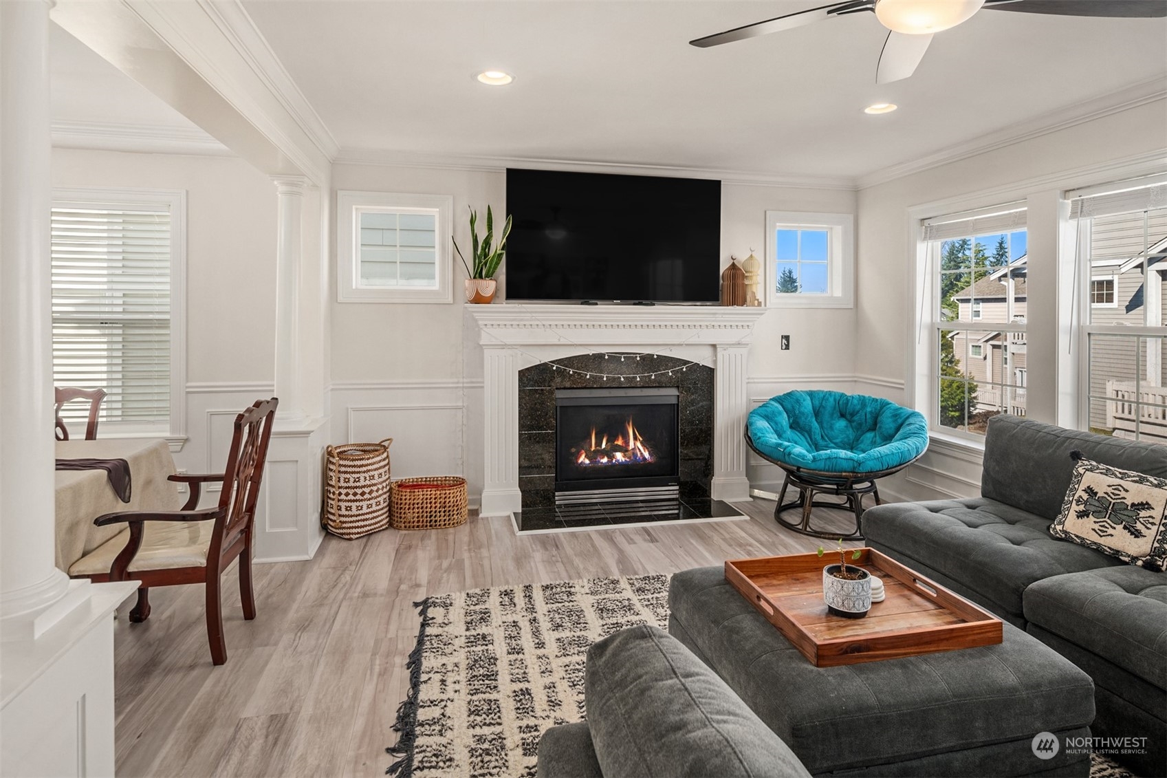 10217 Southeast 237th Street Kent, WA 98031 - Photo 4 of 28 a living room with furniture a flat screen tv and a fireplace