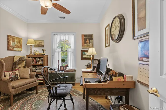 a view of a livingroom with furniture and a window