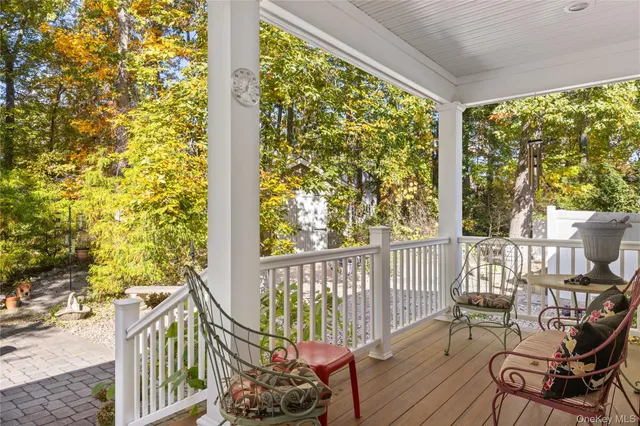 a view of a balcony with chairs