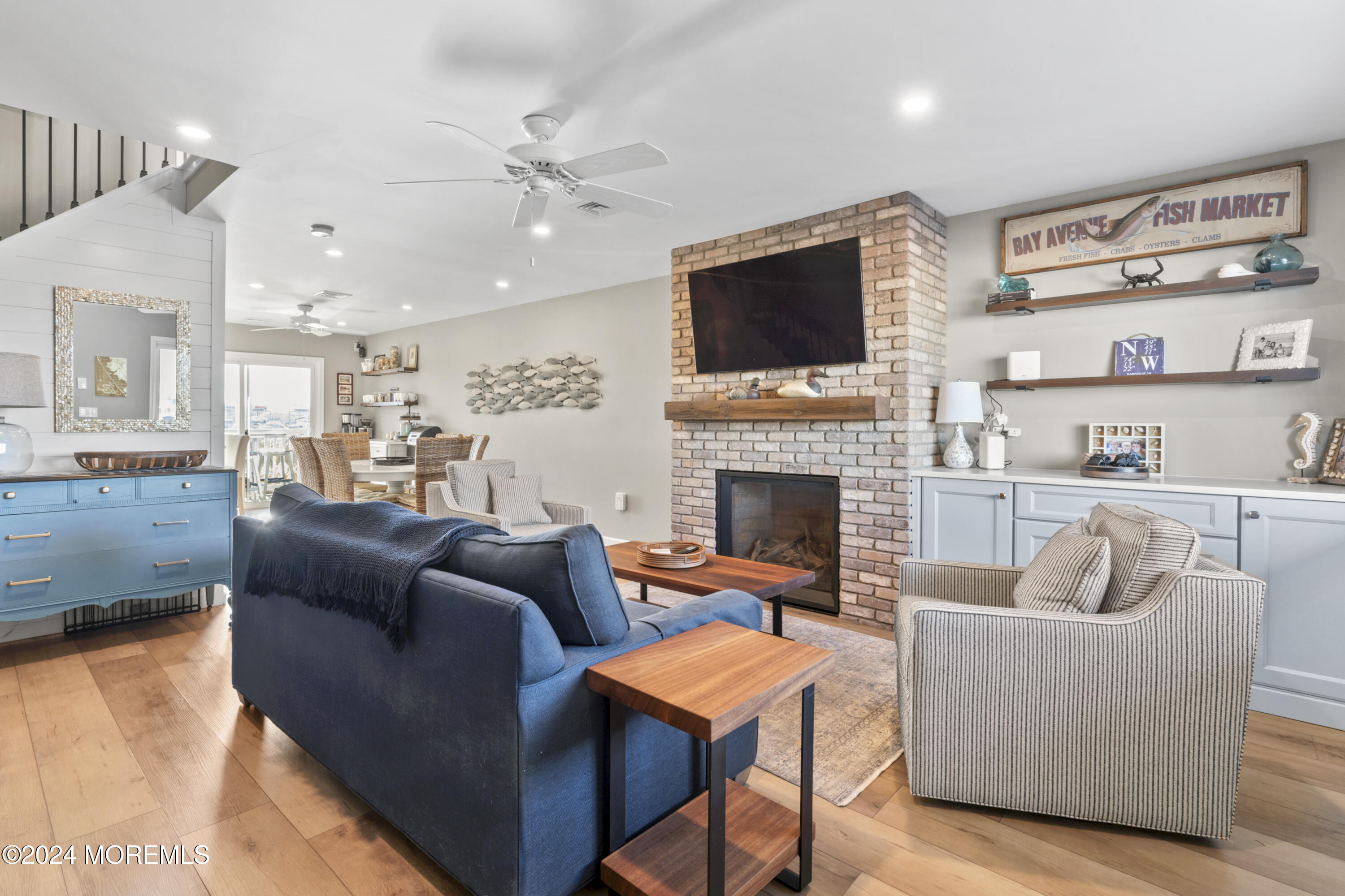 441 East Bay Avenue, Unit 10 Barnegat, NJ 08005 - Photo 11 of 53 a living room with furniture fireplace and a flat screen tv