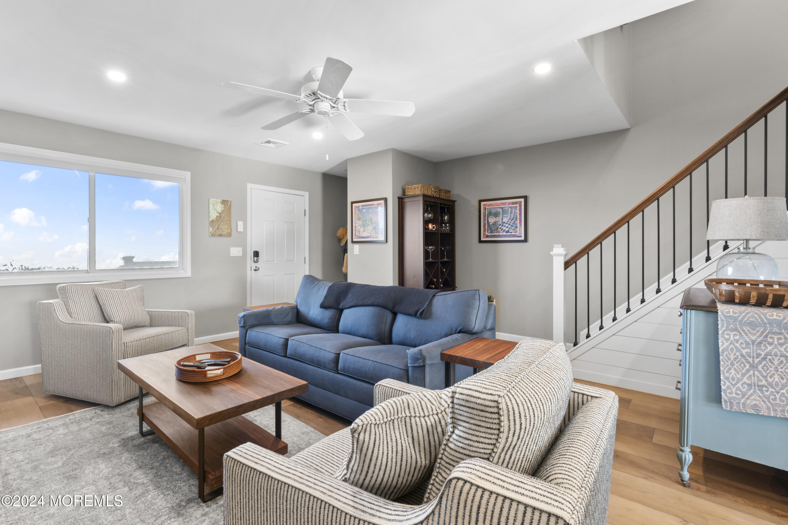 441 East Bay Avenue, Unit 10 Barnegat, NJ 08005 - Photo 14 of 53 a living room with furniture and a ceiling fan