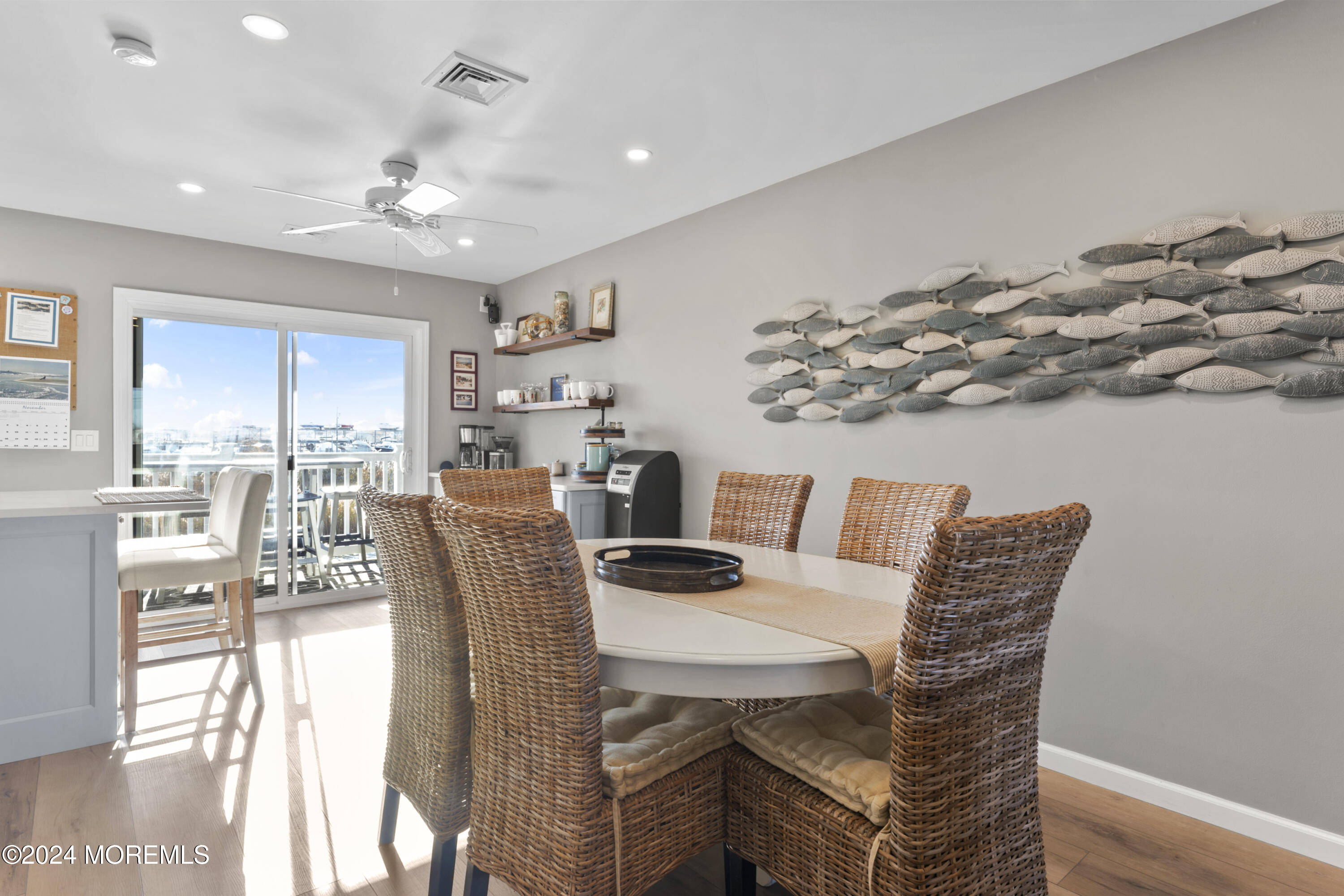 441 East Bay Avenue, Unit 10 Barnegat, NJ 08005 - Photo 15 of 53 a dining room with furniture and chandelier