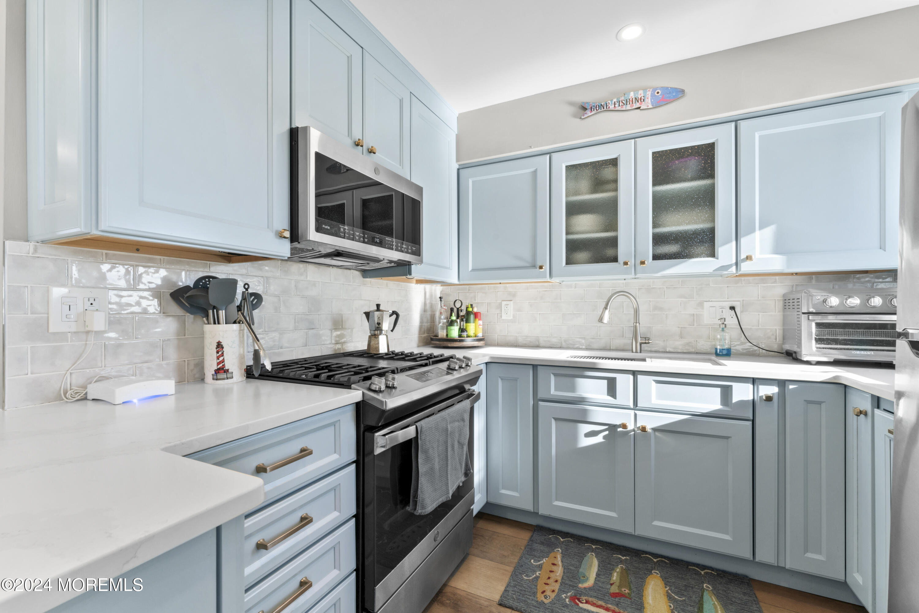 441 East Bay Avenue, Unit 10 Barnegat, NJ 08005 - Photo 16 of 53 a kitchen with stainless steel appliances granite countertop a stove and a sink