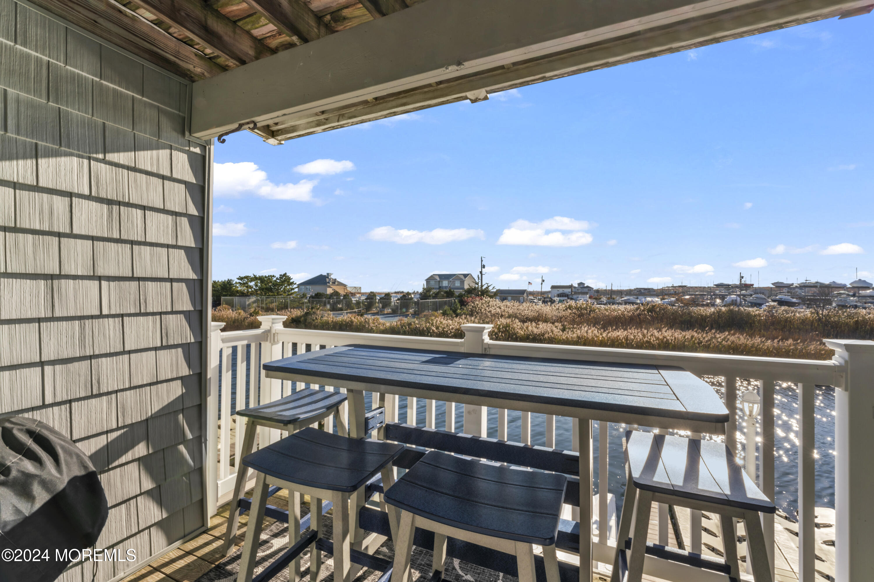 441 East Bay Avenue, Unit 10 Barnegat, NJ 08005 - Photo 20 of 53 a view of a balcony with furniture