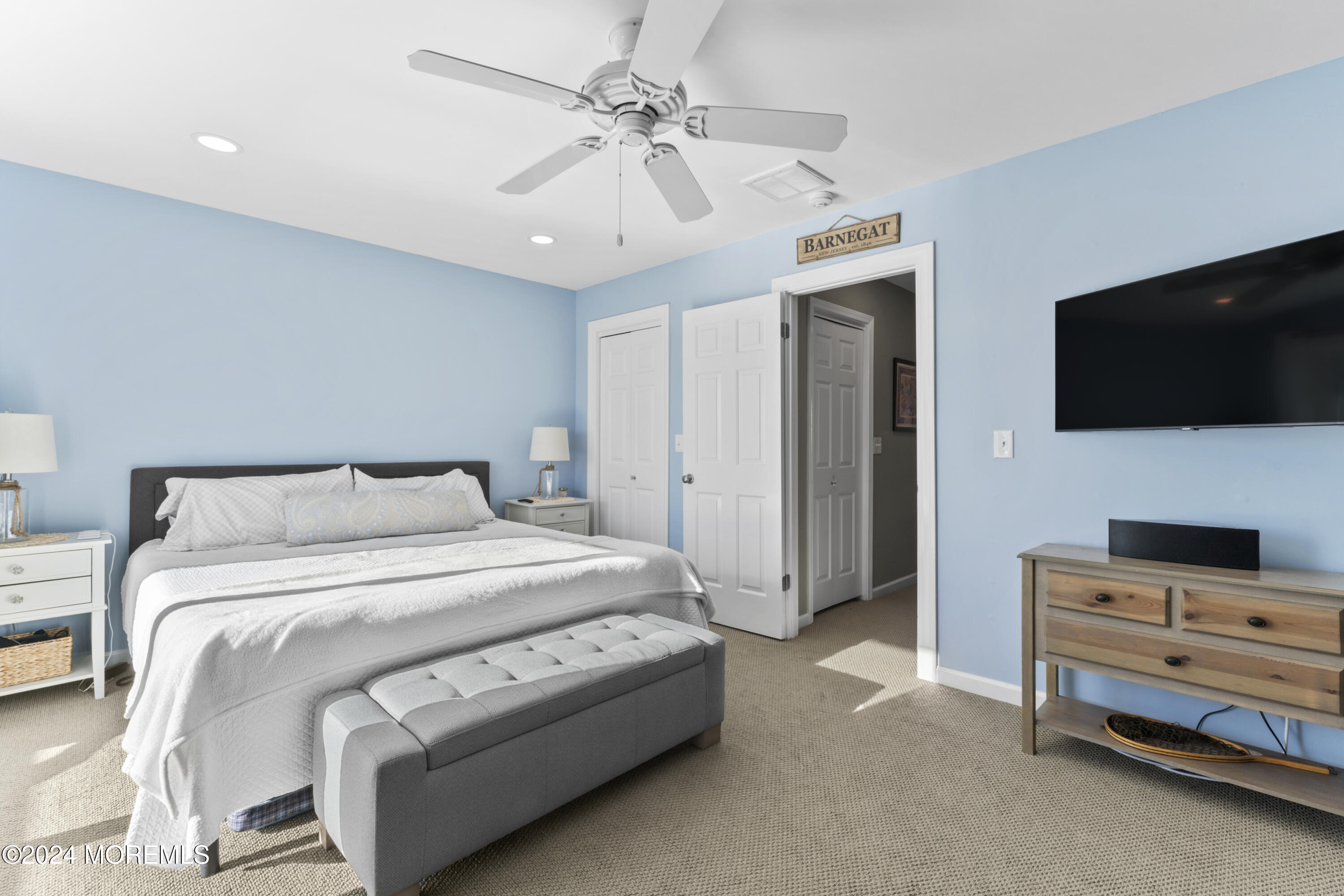 441 East Bay Avenue, Unit 10 Barnegat, NJ 08005 - Photo 24 of 53 a spacious bedroom with a bed and a flat screen tv