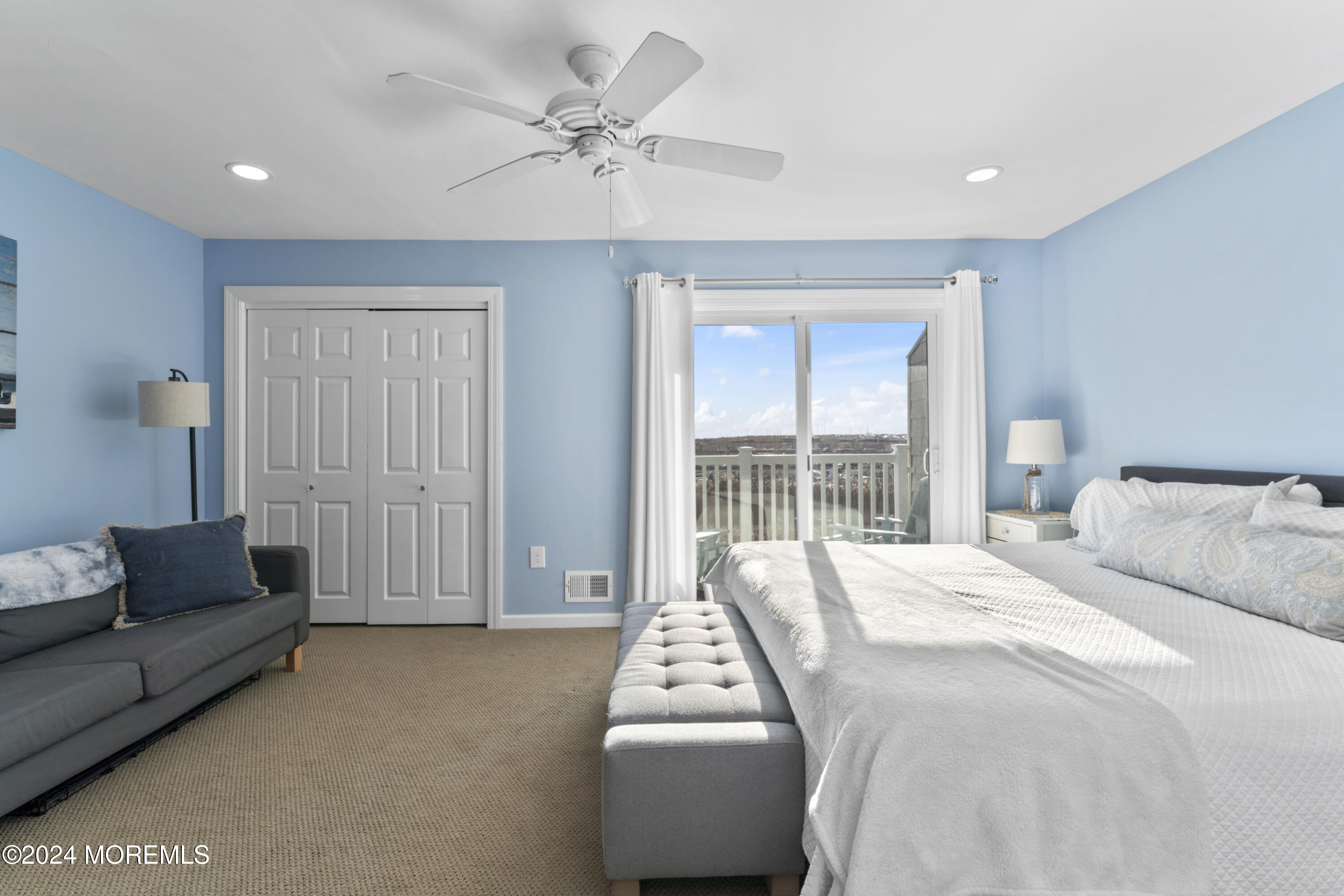 441 East Bay Avenue, Unit 10 Barnegat, NJ 08005 - Photo 25 of 53 a spacious bedroom with a bed and a couch